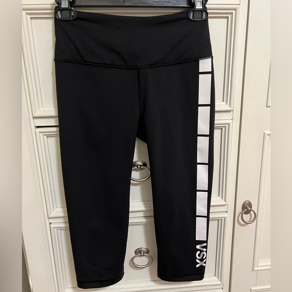 Victoria’s Secret workout capris Black w/ white lettering small pocket in front